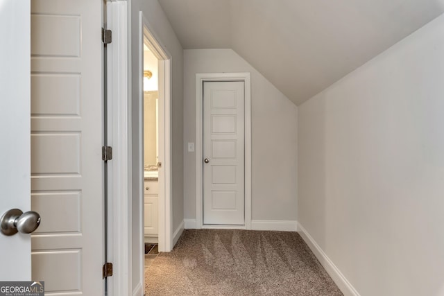 additional living space featuring vaulted ceiling, carpet flooring, and baseboards