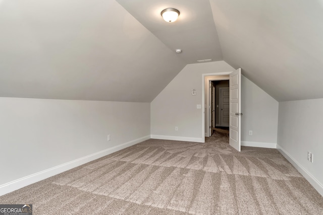 bonus room with carpet, lofted ceiling, and baseboards