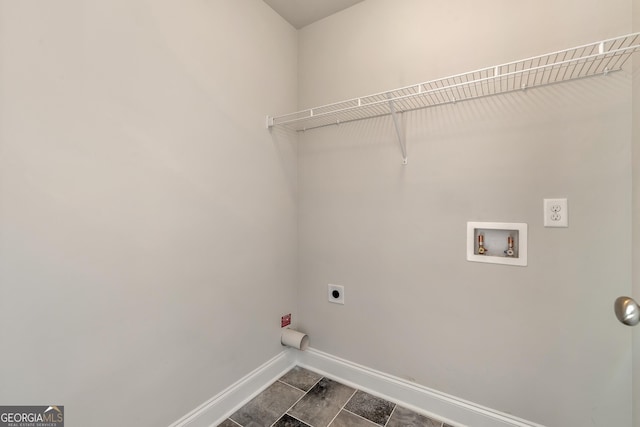 washroom with laundry area, hookup for a washing machine, baseboards, and hookup for an electric dryer