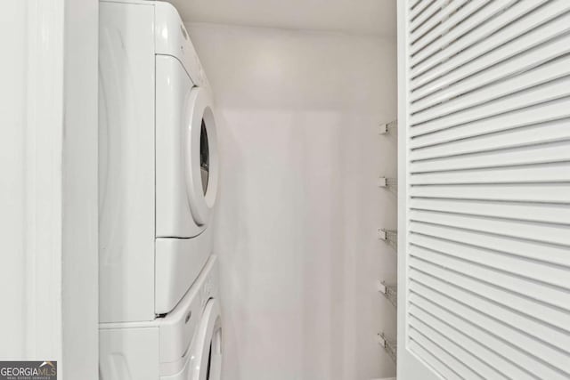 laundry room featuring stacked washer and dryer