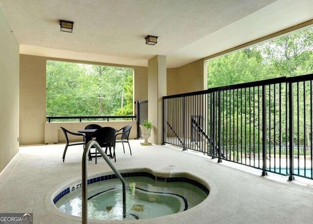 balcony featuring a hot tub