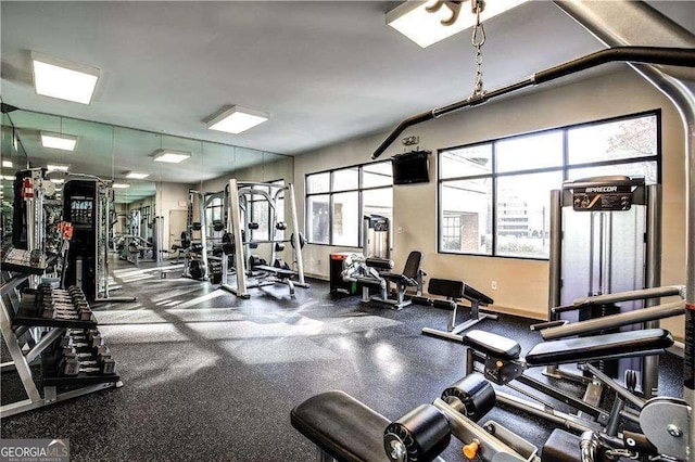 workout area featuring baseboards