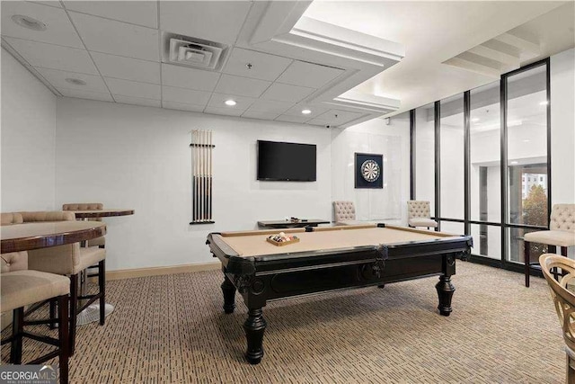 playroom featuring a paneled ceiling, light colored carpet, visible vents, a wall of windows, and baseboards