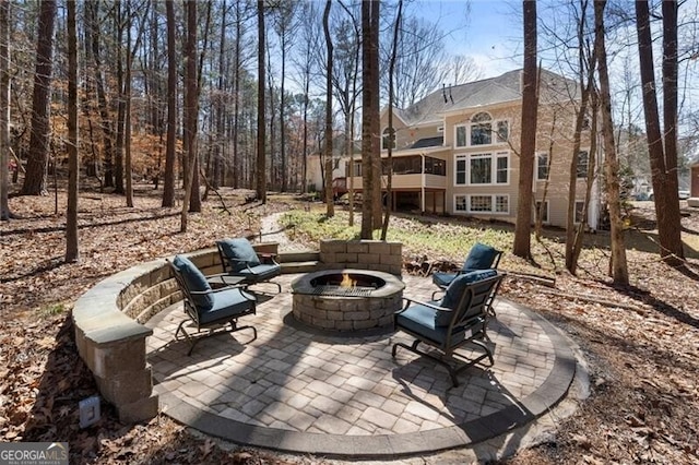 view of patio with a fire pit