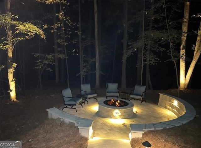 view of patio / terrace featuring an outdoor fire pit