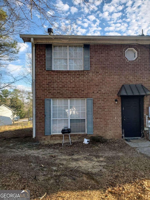 view of front of house featuring brick siding