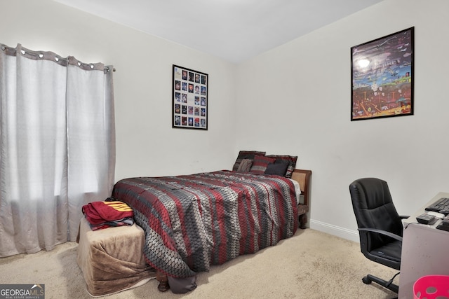 carpeted bedroom with baseboards