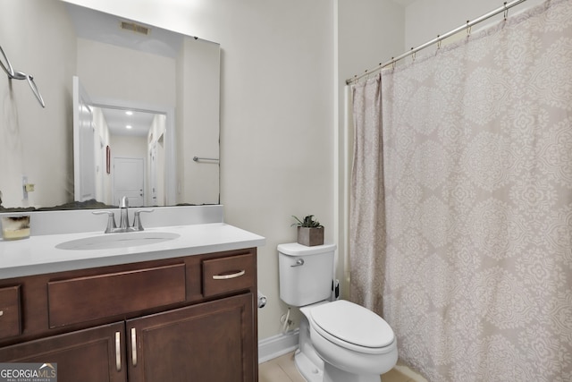 full bath with visible vents, vanity, and toilet