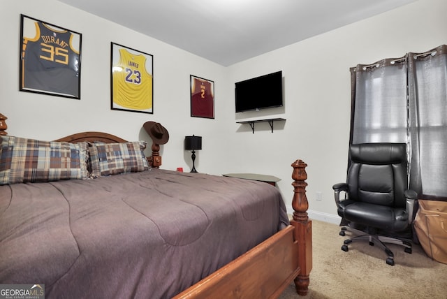 carpeted bedroom featuring baseboards