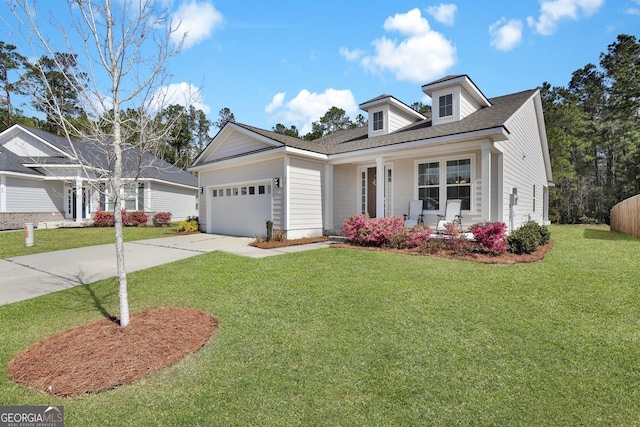 view of front of property with concrete driveway, an attached garage, and a front yard