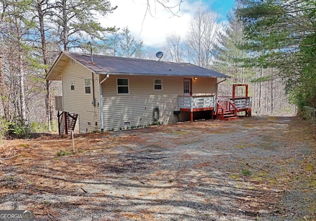 rear view of property with a deck