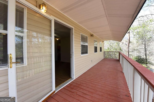 wooden terrace with a porch