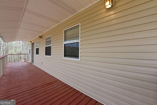 wooden terrace with a porch