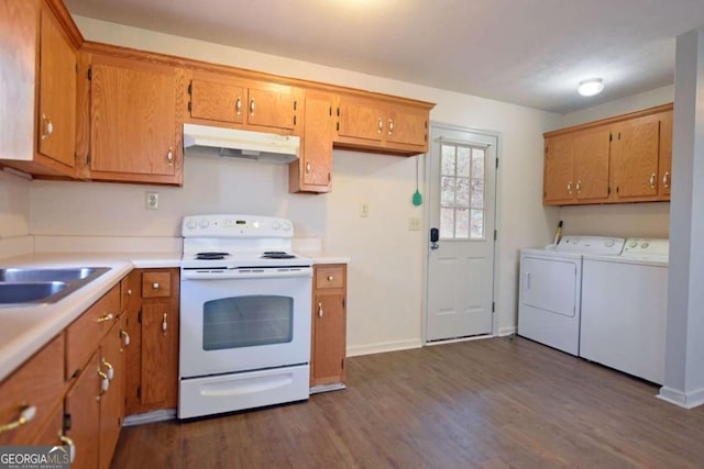 kitchen featuring white electric range oven, under cabinet range hood, dark wood-style floors, and washer and dryer