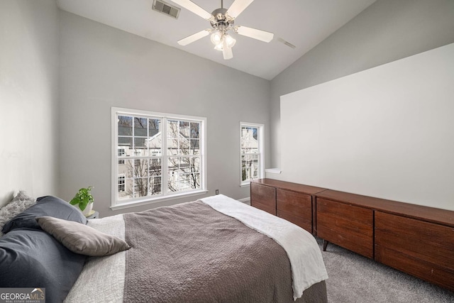 bedroom with visible vents, vaulted ceiling, light carpet, and ceiling fan