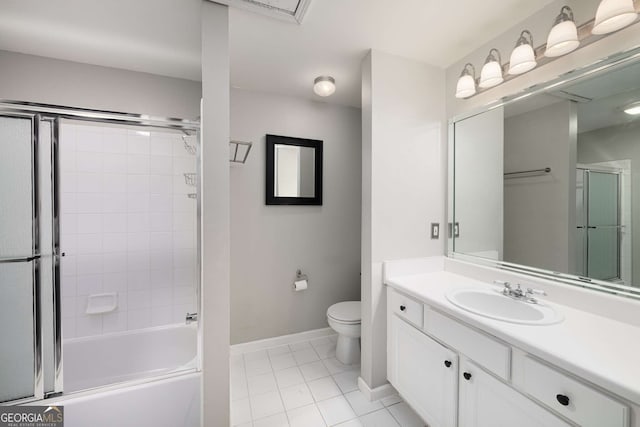 bathroom with vanity, tile patterned flooring, toilet, and baseboards