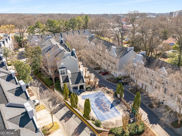 birds eye view of property with a residential view