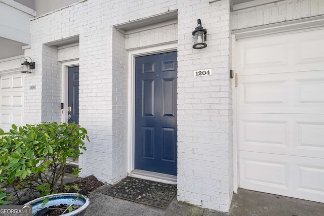 property entrance with brick siding