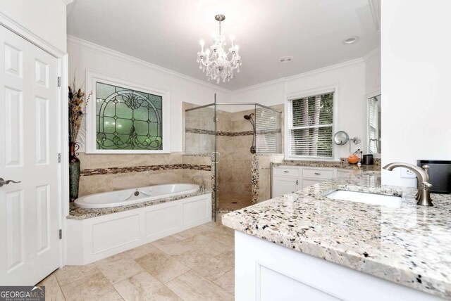 bathroom with a stall shower, an inviting chandelier, crown molding, a bath, and vanity