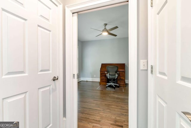 office area with baseboards, ceiling fan, and wood finished floors