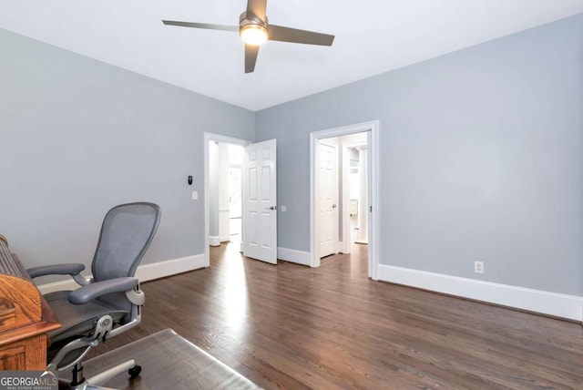 office area featuring baseboards, wood finished floors, and a ceiling fan