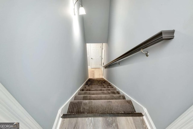 stairs featuring baseboards