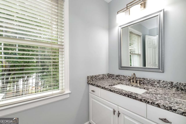 bathroom featuring vanity and a healthy amount of sunlight