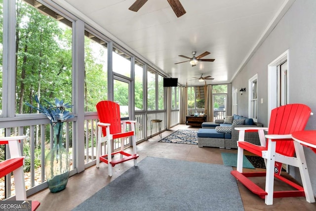 sunroom featuring ceiling fan