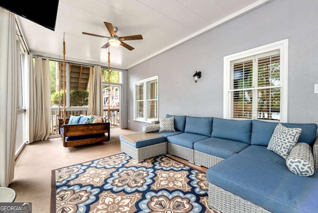 living area with a ceiling fan