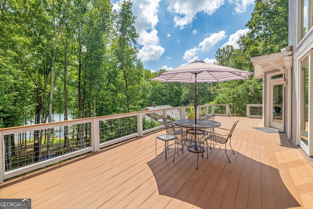 wooden deck with outdoor dining area