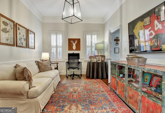 home office featuring crown molding and wood finished floors