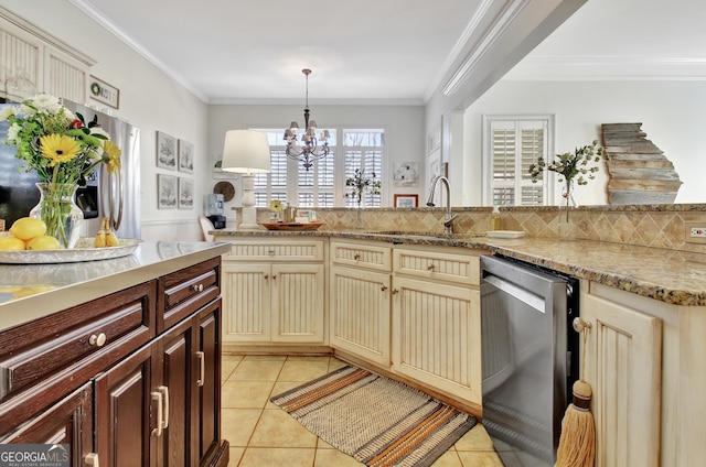 kitchen with crown molding, light tile patterned floors, cream cabinets, a sink, and dishwasher