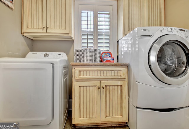 laundry room featuring cabinet space and washer and dryer