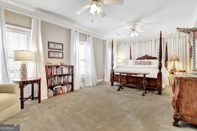 bedroom featuring carpet flooring, crown molding, and ceiling fan