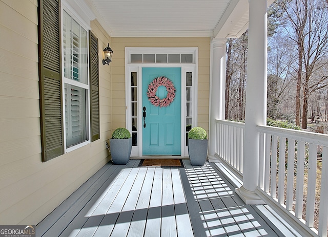 entrance to property featuring a porch