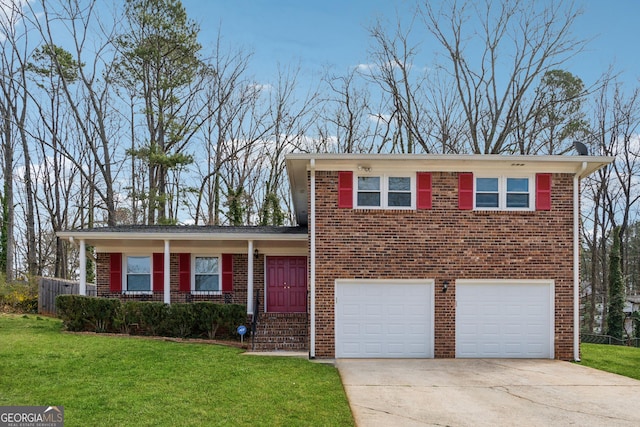 split level home with a front lawn, an attached garage, brick siding, and driveway