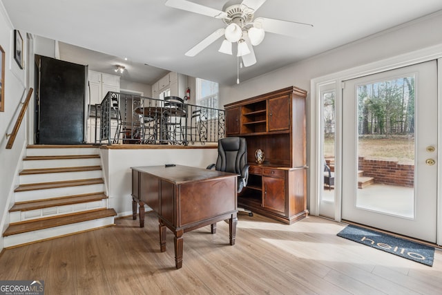 office space featuring ceiling fan and light wood-style floors