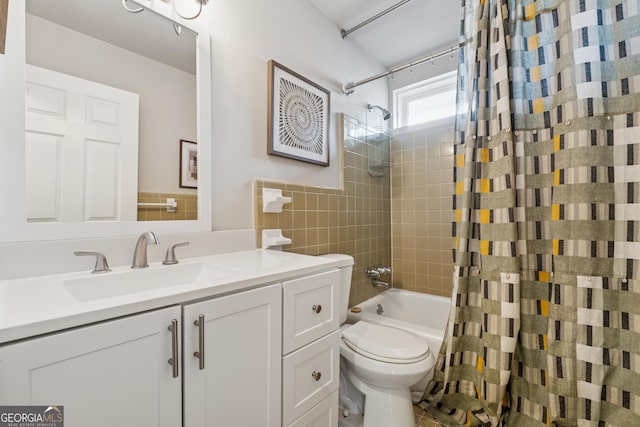 bathroom with vanity, toilet, and shower / bathtub combination with curtain