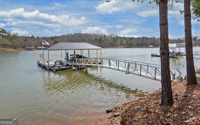 view of dock featuring a water view and boat lift