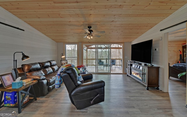 living room featuring wood ceiling, vaulted ceiling, and wood finished floors