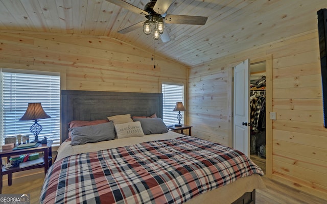 bedroom featuring vaulted ceiling, wooden ceiling, and wooden walls