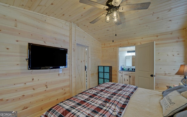 bedroom featuring vaulted ceiling, wood walls, ensuite bath, and wood ceiling