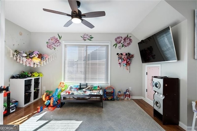 playroom featuring lofted ceiling, ceiling fan, wood finished floors, and baseboards