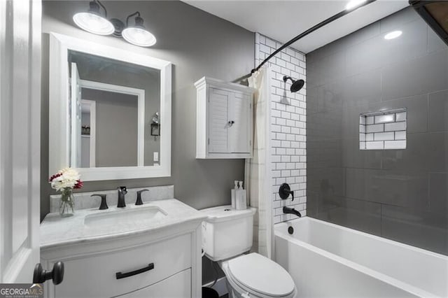 full bathroom featuring toilet,  shower combination, and vanity