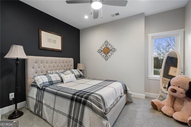 bedroom featuring carpet floors, baseboards, visible vents, and ceiling fan