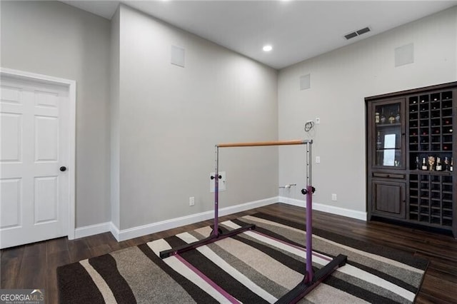 entrance foyer with baseboards, visible vents, wood finished floors, and recessed lighting