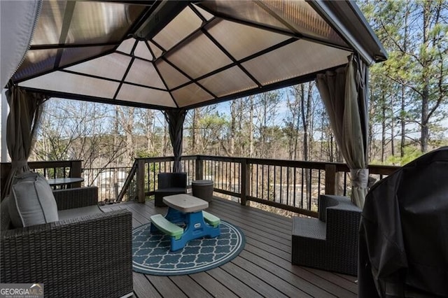 deck with a grill and a gazebo