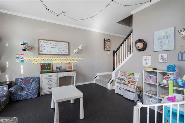 game room with baseboards and crown molding