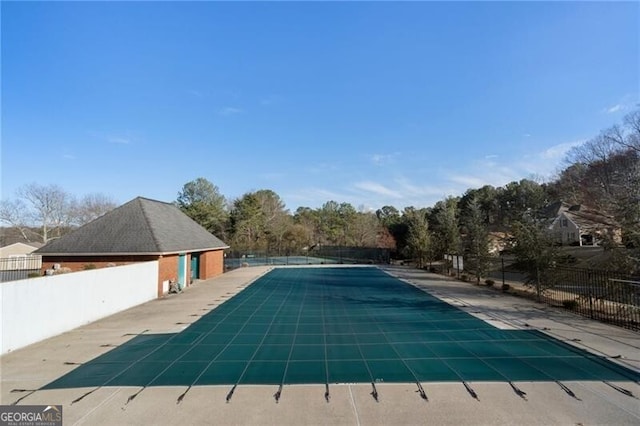 view of pool with a fenced in pool, a patio area, and fence