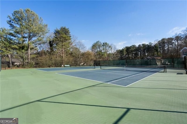 view of sport court with fence